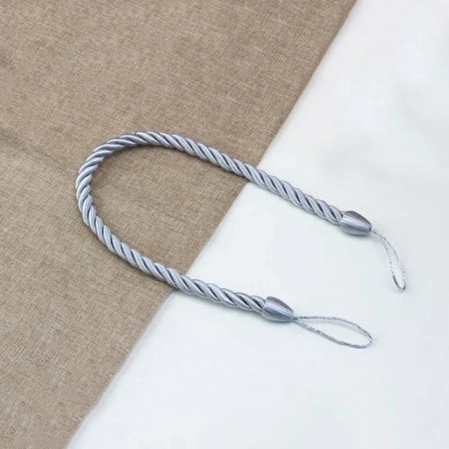 Dekorativt gardinbånd flettet af reb