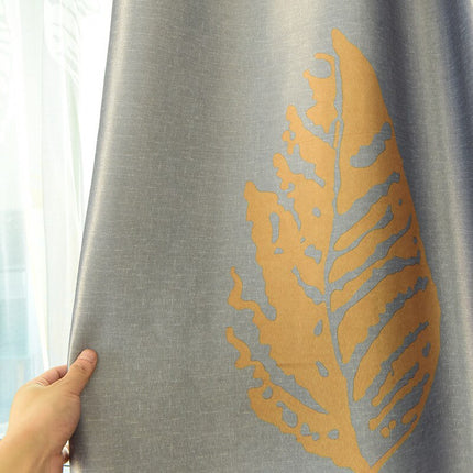 Mørklægningsgardin med gyldent bladmotiv