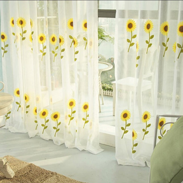 Let gardin broderet med solsikker