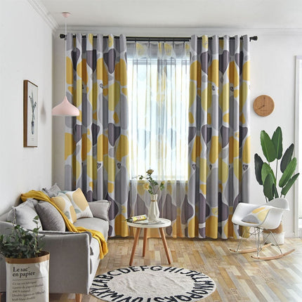 Mørklægningsgardin med abstrakt gul-grå mønster