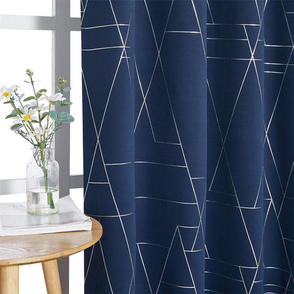 Blåt mørklægningsgardin med geometrisk mønster