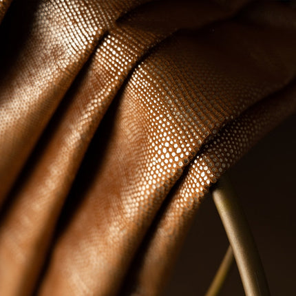 Orange mørklægningsgardin med struktur