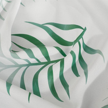 Hvidt gardin med grønne palmeblade