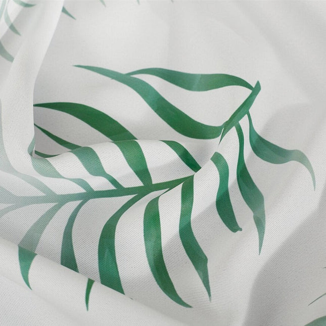 Hvidt gardin med grønne palmeblade