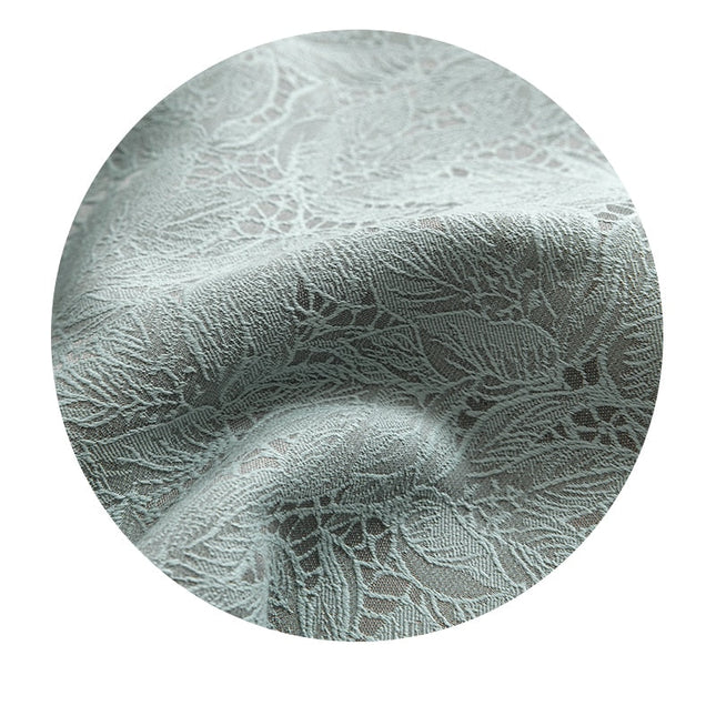 Pistaciegrønt mørklægningsgardin med jacquard mønster