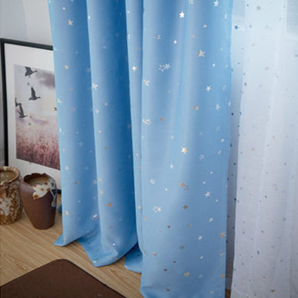 Himmelblåt mørklægningsgardin med guld stjerner