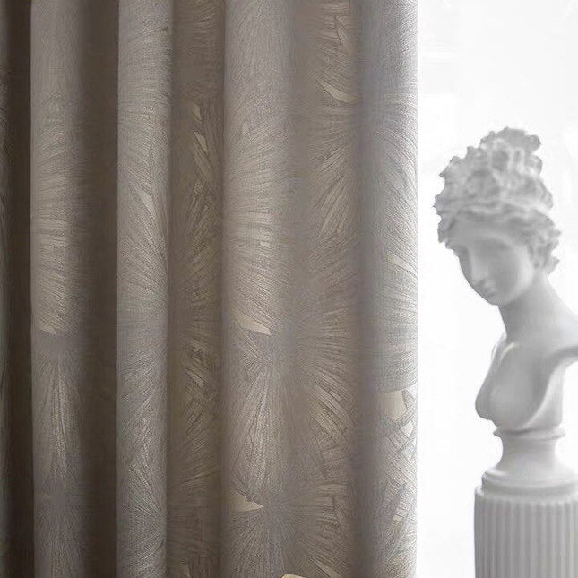 Mørklægningsgardin med diskret bladmotiv