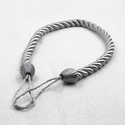 Dekorativt gardinbånd flettet af reb