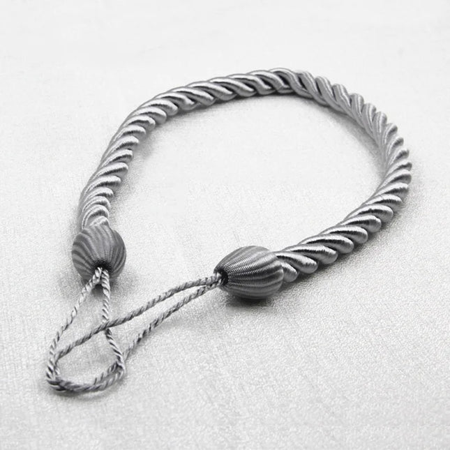 Dekorativt gardinbånd flettet af reb