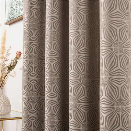 Brunt gardin med geometrisk art-deco mønster