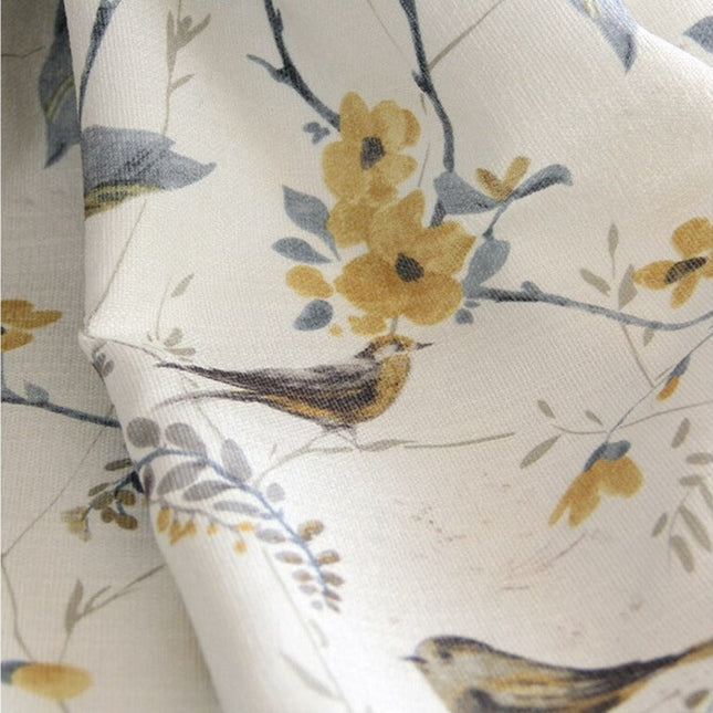 Gardin i hørlook med fugle