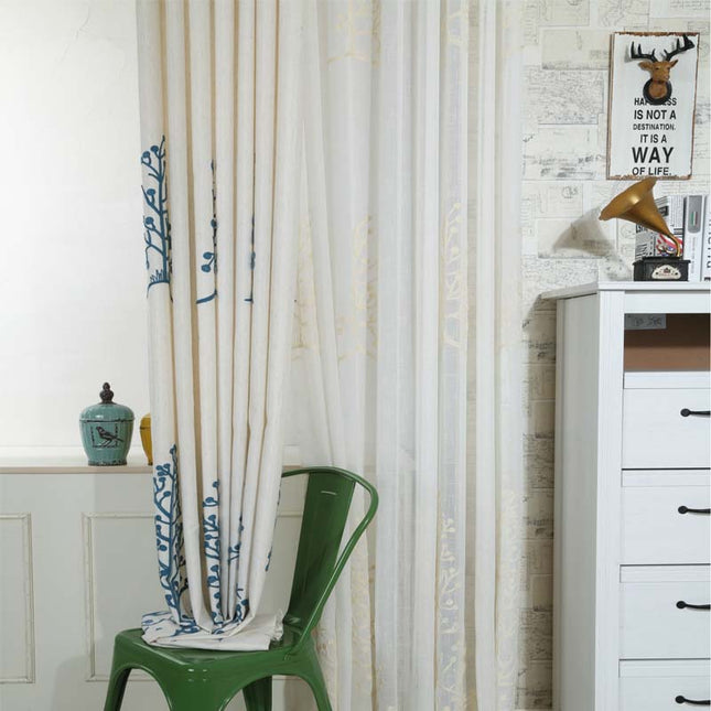 Gennemsigtigt gardin i hørlook med broderi