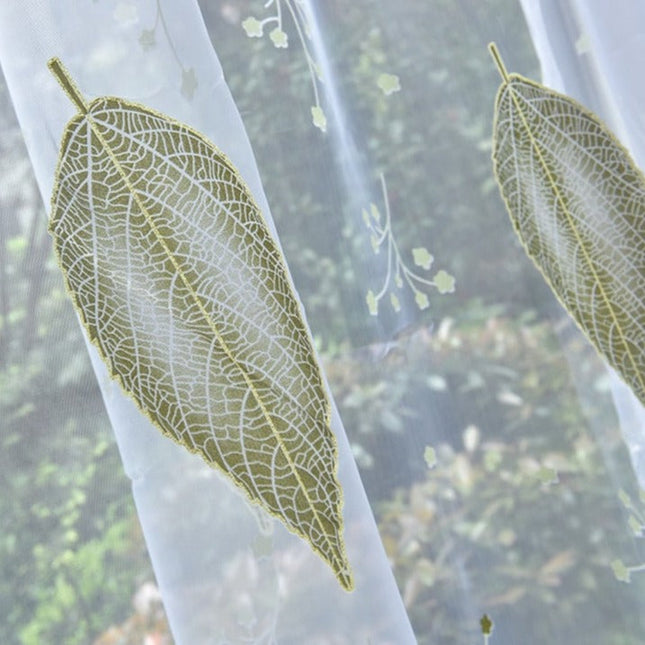 Gennemsigtigt gardin med grønt bladmønster