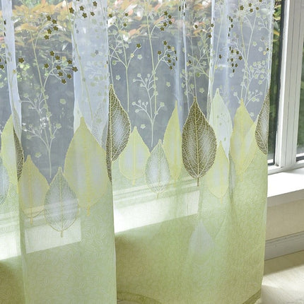 Gennemsigtigt gardin med grønt bladmønster