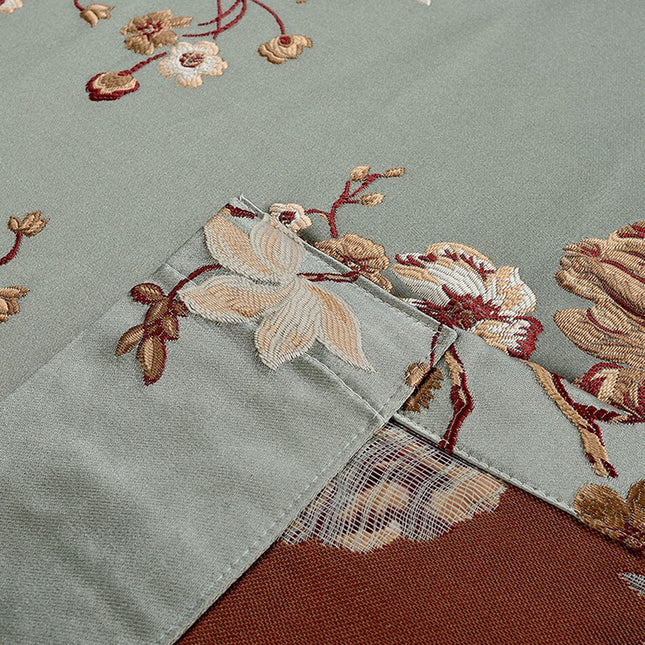 Elegant mørklægningsgardin med blomstermotiv