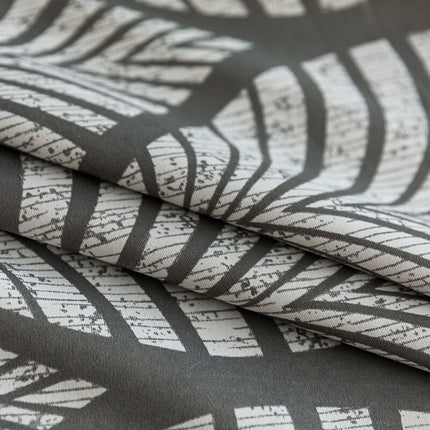 Gråt mørklægningsgardin med bladmotiv