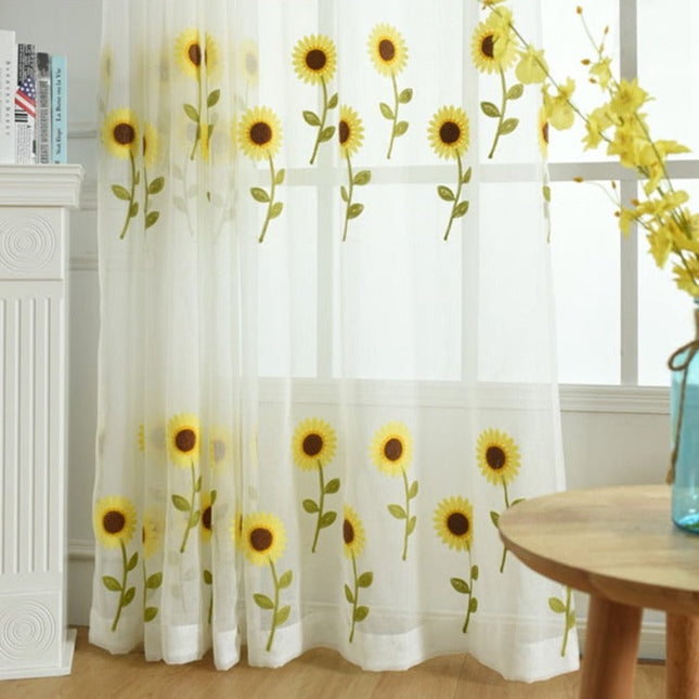 Let gardin broderet med solsikker