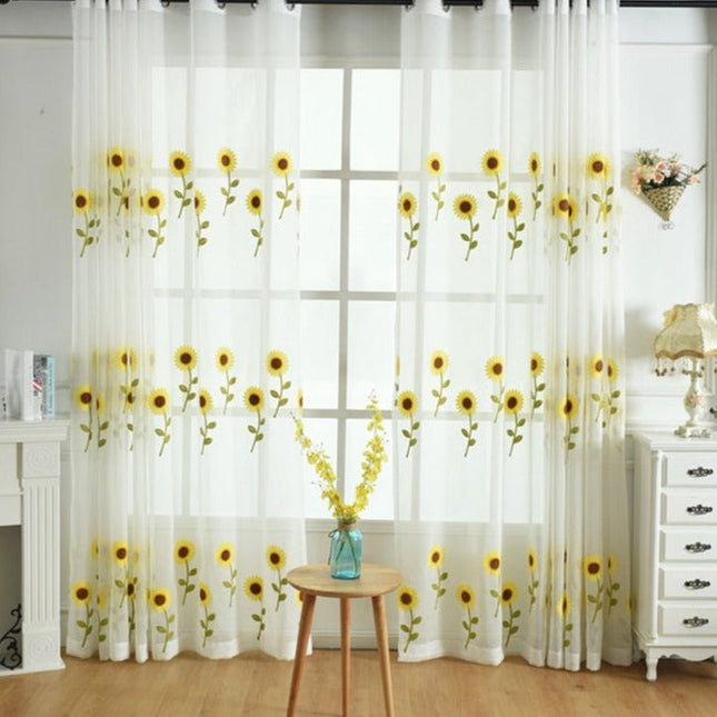 Let gardin broderet med solsikker