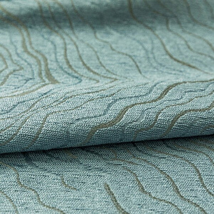 Blåt mørklægningsgardin med bølgemønster