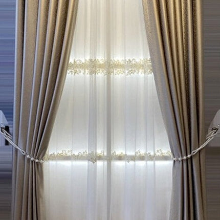 Skinnende mørklægningsgardin i gylden nuance