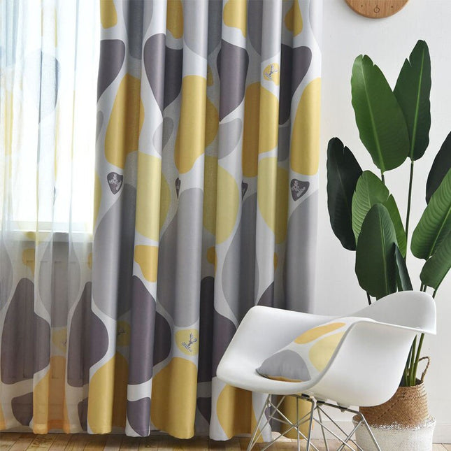 Mørklægningsgardin med abstrakt gul-grå mønster