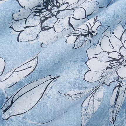 Mørklægningsgardin med blåt blomstermotiv