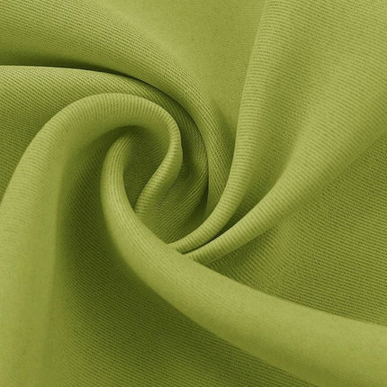 Æblegrønt mørklægningsgardin med øjer