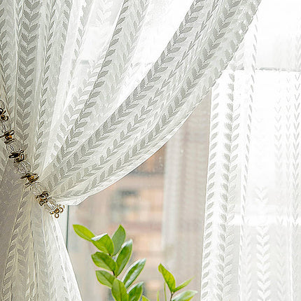 Hvidt gardin med sildebensmønster