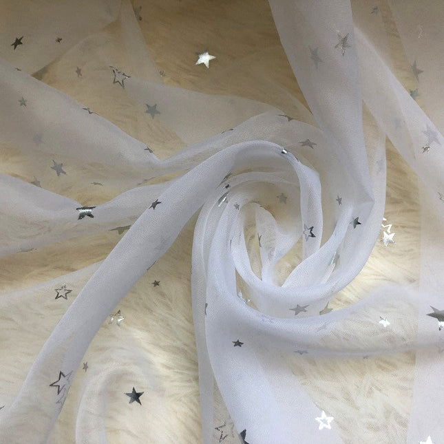 Gennemsigtigt gardin med sølv stjerner