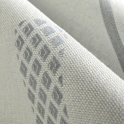 Gråt mørklægningsgardin med grafisk mønster